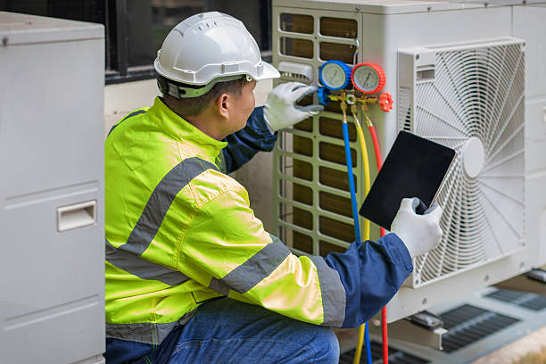 Professional Heat Pump Repair technician working in Suwanee, GA